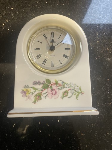 Aynsley beside alarm clock