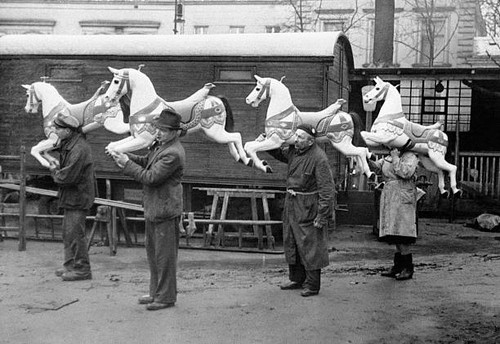 Fairground workers carry