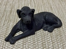 Black Labrador dog figurine.
