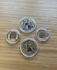 lot of 4 gold plated & enamel British coins in original capsules