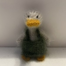Miniature hand knitted baby