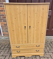 LIGHT PINE EFFECT LINEN CUPBOARD TALLBOY WITH SHELVED CUPBOARD AND 2 DRAWERS
