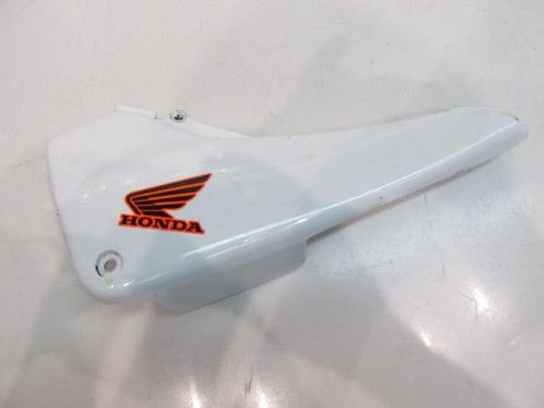 Fairing cover under left seat