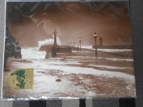 Whitby west pier high seas - high,