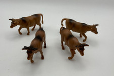 4 Plastic Cow Toy Figures for