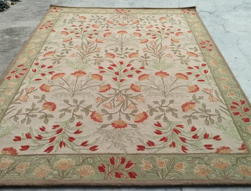 Hand tufted floral wool area