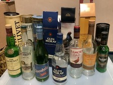 Seven Whisky Bottles (empty)