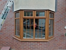 Golden oak outside / white inside upvc bay window x2. Sold separately
