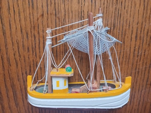 Small wooden ship with - small, sails
