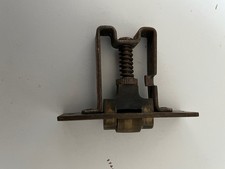 Roller doorlatch adjustable spring, brass face plate, etched with patent number 