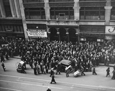 Porters pushing sack trucks &