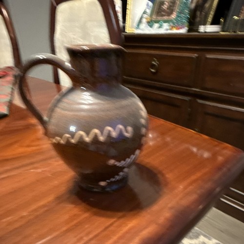 Brown glossy ceramic pottery - glossy,