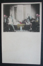 Old Asia CHINA Hand Tinted Postcard CHINESE OPIUM DEN MEN SMOKE OPIUM PIPES