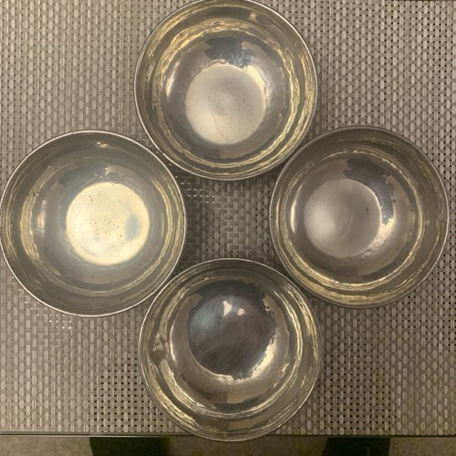 Four hammered pewter bowls - four,