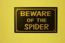 BEWARE OF THE SPIDER sign or