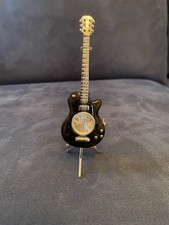 Black Guitar Clock WM. WIDDOP