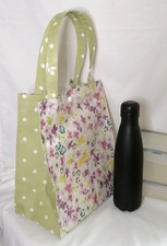 Lunch tote with snap fastener