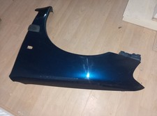 Genuine Peugeot 106 passenger side front wing phase 2 in dark blue.
