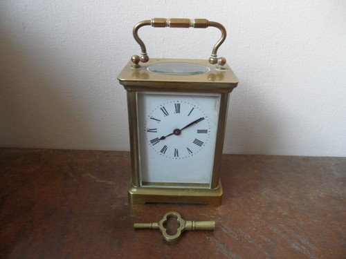 Antique brass carriage - clock,