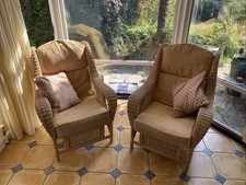A Pair Of Wicker Armchairs With Cushions