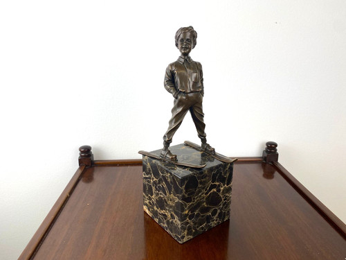 Bronze sculpture boy with ski