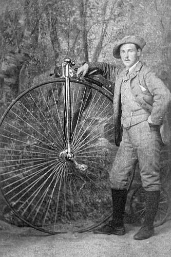 Man with penny - a, penny-farthing