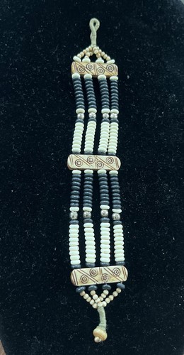 Vintage native bone bead - &,