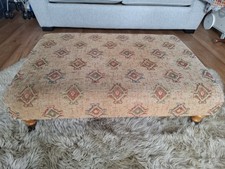 Large Upholstered Footstool with Wooden Feet And Brass Castors