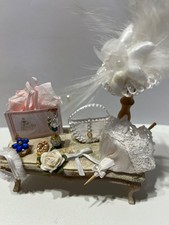 Dolls house table hand decorated- hat,umbrella,bag,hat pins,flowers carrier bag