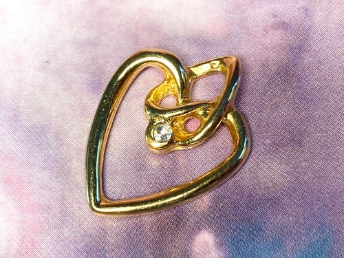 Filigree gold tone heart with