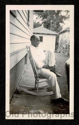 Bald man rocking chair holding - man,