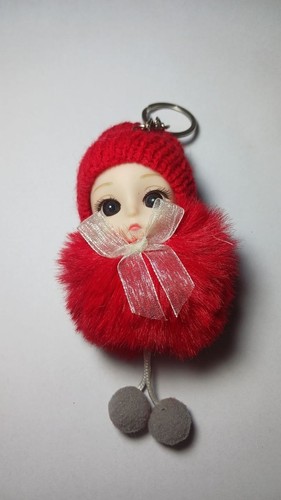 Red fluffy pom - pom, doll