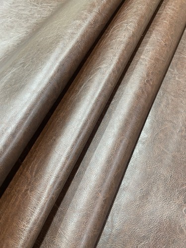 Heavy feel brown faux leather - feel,