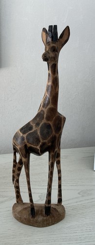 Hand carved wooden giraffe - hand,