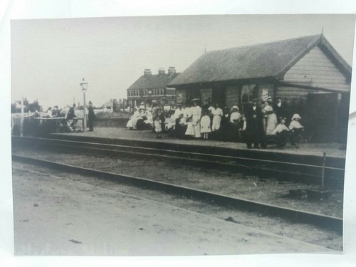 Patrons awaiting train - awaiting,