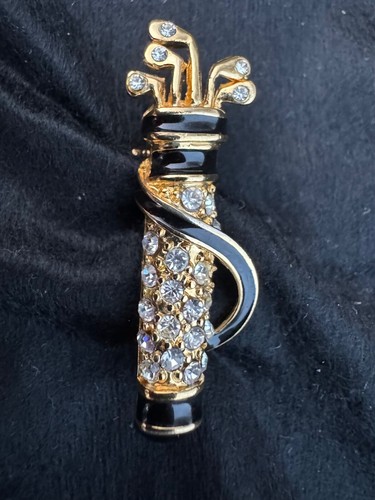 Golf bag and clubs - and, brooch