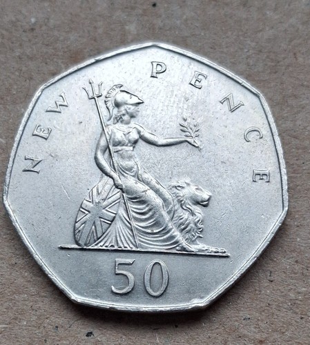 Large old style 50p coin - old,