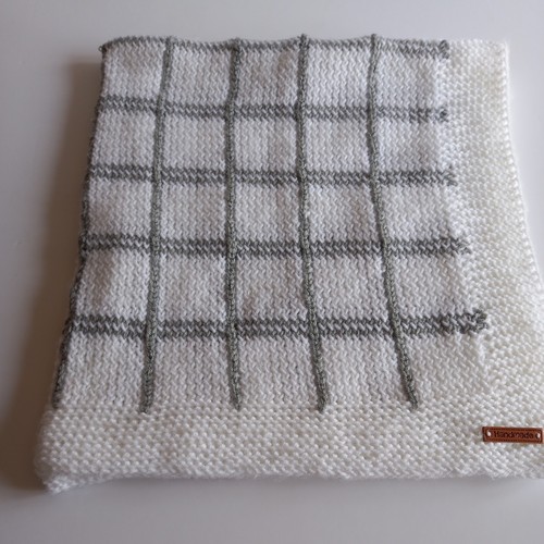Hand knitted white baby - hand,