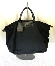 TUMI Black Nylon with Leather Handles Carry On Duffle Travel Bag
