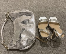 Lady’s silver shoe and bag