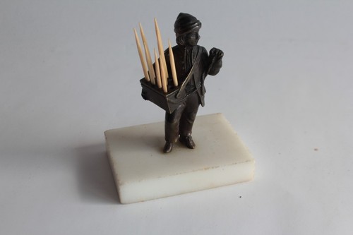Bronze figure holding - , a