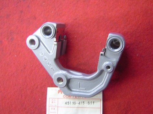 Left front caliper bracket - left,