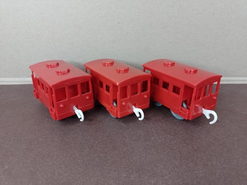 Three red brake vans - three,