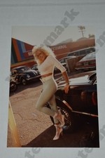 busty blonde woman big hair