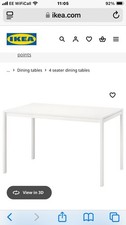 White Wooden Dining Table with 4 Chairs.