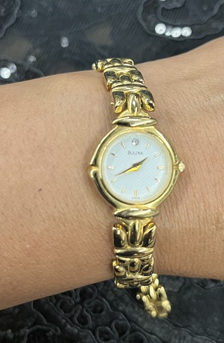 Bulova woman gold tone watch - woman's,