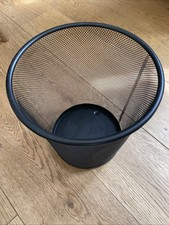Round, black metal mesh trash can or waste bin