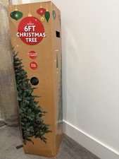 6ft Artificial Christmas tree with pine cones and red berries.