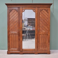 Gothic antique brown oak wardrobe by Marsh, Jones & Cribb