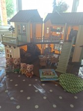 Sylvanian Families Beechwood Hall with Furniture and Bear Family Accessories.